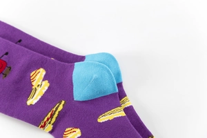 Detailed close-up of purple crew socks with hot dog patterns and reinforced blue heel design