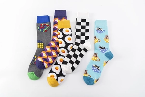 Detail of five creative crew socks featuring poached egg, Rubik's cube, and cat prints