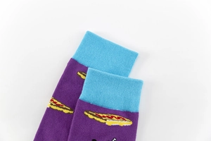 Close-up of purple cotton crew socks featuring blue ribbed cuffs and cartoon food patterns