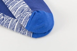 Detailed macro view of the knitted cotton sock with navy and royal blue texture
