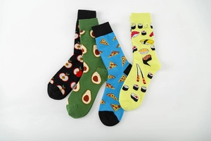Detail of four colorful cotton socks featuring apple, avocado, pizza, and sushi food patterns