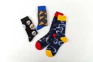 Detailed view of mid-calf cotton socks with skull, pizza, anchor, and narwhal patterns