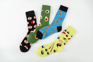 Detailed flat lay of four cotton crew socks featuring apple, avocado, pizza and sushi patterns