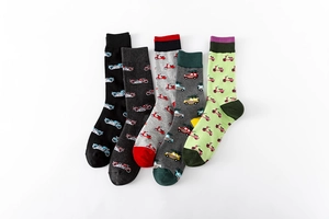 Detail of five crew socks featuring unique vintage vehicle embroidery in various colors