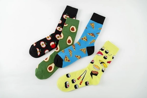Detailed flat lay of four cotton crew socks with apple, avocado, pizza and sushi prints