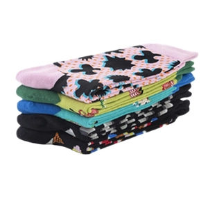 Set of colorful crew socks with diverse patterns like polka dots and geometric prints