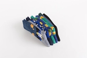 Detail showing stacked crew socks with rockets, pineapples, and checkered patterns