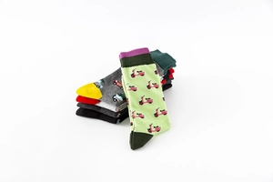 Detail of colorful cotton crew socks featuring various knitted cartoon patterns