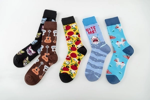 Detail of five creative printed mid-calf cotton socks with guitar and animal patterns