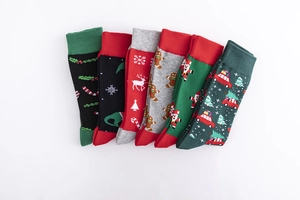 Set of six Christmas themed cotton crew socks with festive reindeer and snowflake patterns