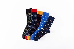 Detail of five pairs of cotton mid-calf socks with colorful vehicle pattern prints