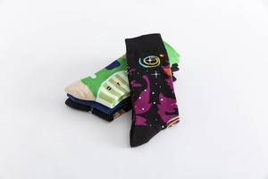 Detailed flat lay of colorful patterned mid-calf cotton socks with ribbed elastic cuffs
