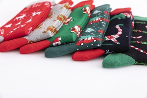 Colorful cotton Christmas socks with reindeer and gingerbread man patterns set