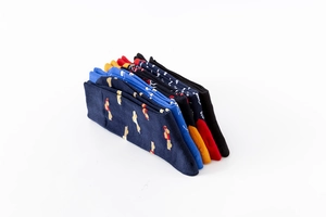Close-up of five pairs of colorful cotton socks with vibrant geometric patterns
