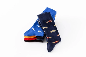 Close-up of colorful cotton crew socks featuring helicopter and truck embroidery