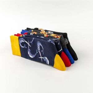 Five pairs of colorful skull and marine cotton socks for men in a flat lay view