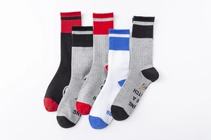 Flat lay of five pairs of colorful athletic cotton socks with elastic ribbed cuffs