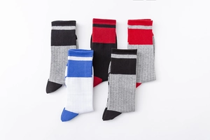 Detail of 5 pairs of athletic cotton crew socks with striped cuffs and colorful accents