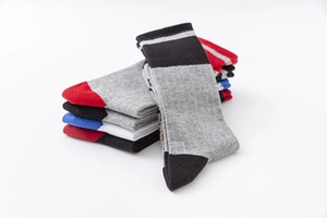 Detail of colorful cotton sports socks featuring reinforced heel and striped cuffs
