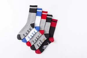 Detailed view of 5-pack colorful striped sports socks with funny slogan on the soles