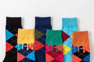 Detailed flat lay of six colorful cotton blend socks featuring argyle and liquid patterns