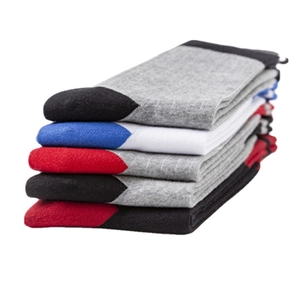 Stack of colorful cotton crew socks in grey white red and black with contrast toe design