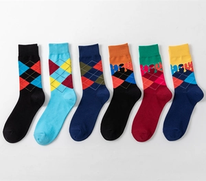 Detail showing set of six vibrant argyle pattern crew socks with creative drip designs