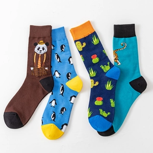 Four-pack of colorful cotton blend crew socks with panda, penguin, and tiger patterns