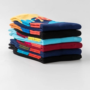 Colorful knitted crew socks with geometric color-block patterns in multiple colors