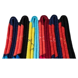 Set of colorful patterned crew socks with stripes and argyle for autumn and winter