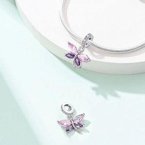 Silver dragonfly charm bead with pink wings on a snake chain for DIY jewelry