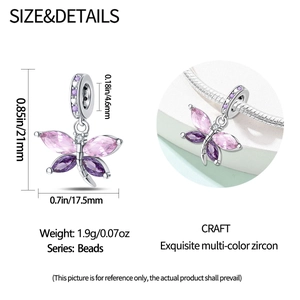 Macro view of butterfly charm with purple marquise crystals and size measurements