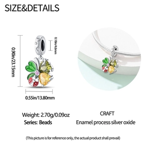 Detailed view of four-leaf clover bead with gemstone petals and ladybug on snake chain