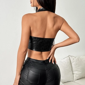 Back view of a black faux leather halter top and tight trousers showing seam details