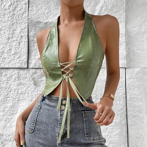 Detail of olive green faux leather halter top with deep V-neck and lace-up front design