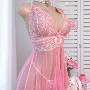 Elegant plus size pink lace and mesh lingerie set with bow detail on mannequin