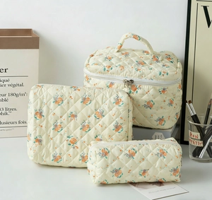 Three-piece quilted cotton cosmetic bags with vintage orange rose floral patterns