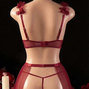 Back view of burgundy sheer lace lingerie set with floral straps on a mannequin