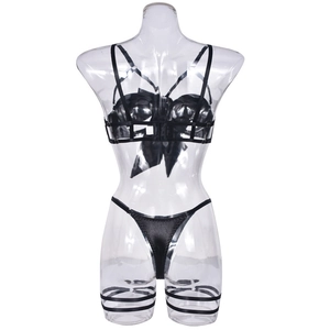 Detailed view of sexy black satin lingerie set featuring criss-cross straps and leg rings