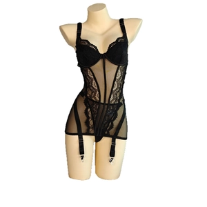Sultry black lace corset bodysuit with floral embroidery and mesh details on mannequin
