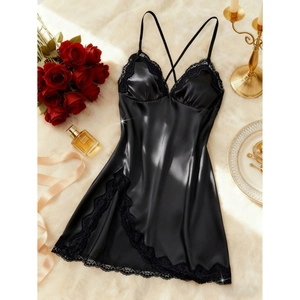 Sexy black satin nightgown with lace V-neck and cross-back straps on soft rug