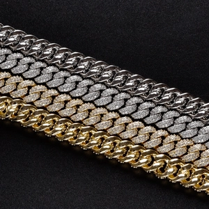 Detail of 10mm Cuban links in gold and silver showing polished and iced out finishes
