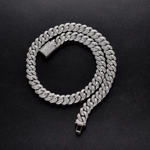 Macro detail of 10mm silver iced out Cuban chain necklace with white cubic zirconia stones