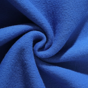 Navy blue fleece sweatshirt fabric close-up showing soft texture and royal blue fibers