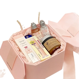 Pink luxury gift box set with cherry blossom hand cream, scented candle and lip balm