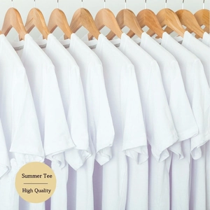 Multiple white cotton Mama Needs Coffee t-shirts hanging on wooden hangers in a row