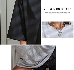 Detail view of cotton blend fabric texture and crew neckline with a stylish ball chain