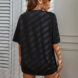Oversized black cotton T-shirt with drop shoulder design shown from a back view