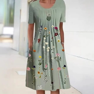 Sage green short sleeve floral dress with crew neck and pleated details