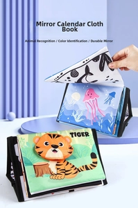 Standing baby cloth book with animal tail sensory pages and baby-safe mirror detail